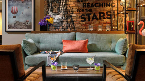 Interior image of a couch and table with drinks on it in Shannon Springs Hotels, Shannon, Co. Clare, Ireland. Best rates and offers guaranteed for Irish hotels when you book with Great National Hotels and Resorts.