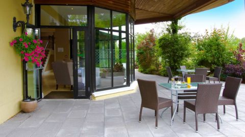 Outdoor seating on a patio outside of a hotel. Great National Hotels and Resorts, the best hotels in Ireland. Book directly for the best hotel deals and rates.